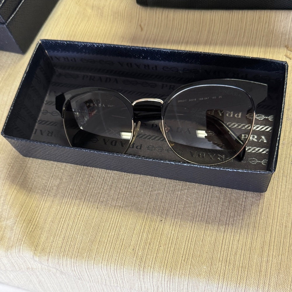Prada Elegant Black and Gold Eyewear